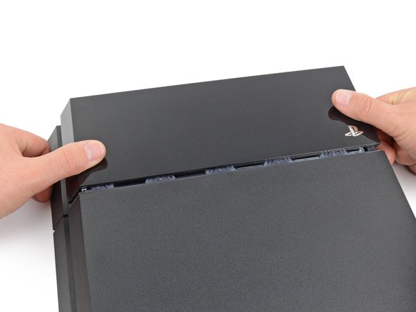 Remove the shiny lid by slotting it to the side - PS4